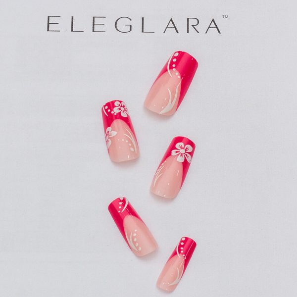 Five medium long stiletto press-on nails with pink hibiscus floral designs on a nude base, featuring white petals and pink blooms at the tips, arranged on a white background with the Eleglara Beauty logo, glossy finish highlighting the romantic, tropical elegance.