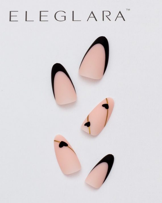 Five medium almond press-on nails with light pink base, black tips, and gold-lined black heart accents on some, arranged on a white background with the Eleglara logo, glossy finish highlighting the cute, romantic designs.