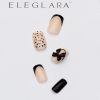 Five short square press-on nails in nude with black french tips, polka dots, and bow accents, arranged artistically on a white background with the Eleglara Beauty logo, glossy finish highlighting the cute, vintage designs.