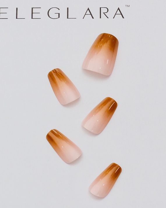 Five medium almond press-on nails with brown to pink gradient, glossy finish, arranged on a white background with the Eleglara logo, showcasing the warm, boho design.
